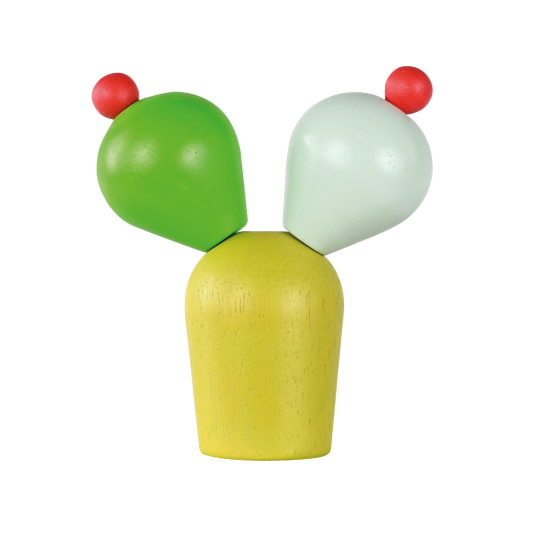 A colorful cactus-shaped baby rattle with green, yellow, and red parts on a wooden base.