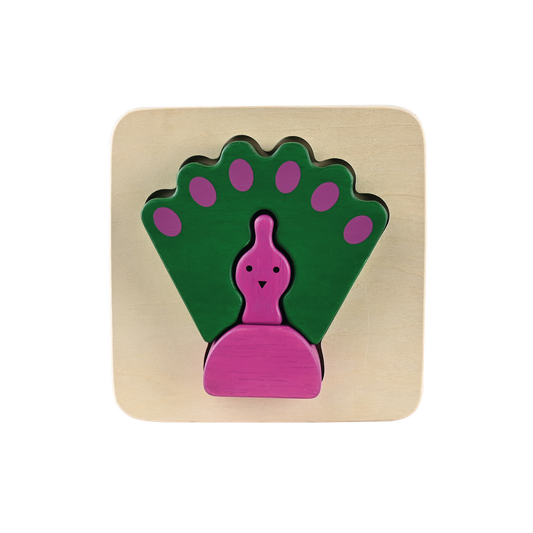 A wooden puzzle piece in the shape of a peacock with green and purple colors.