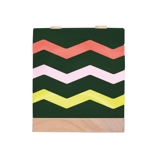 An educational toy consisting of a green block with a pattern of zigzag lines in green, orange, white, and yellow on its upper surface.