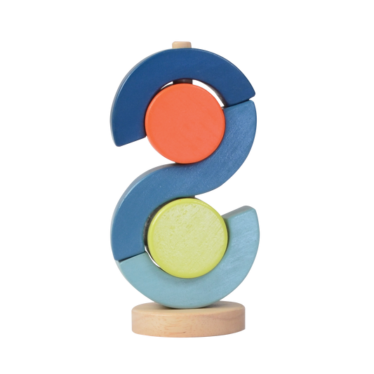 A wooden block toy resembling a segmented circle with red, blue, and green pieces on a wooden base.