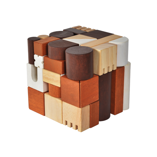 A variety of wooden blocks in different shapes including cubes and cylinders, arranged to form a larger cube-shaped structure.