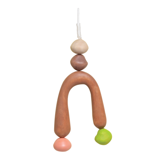 A colorful baby mobile with geometric shapes in brown, pink, green, and blue colors.