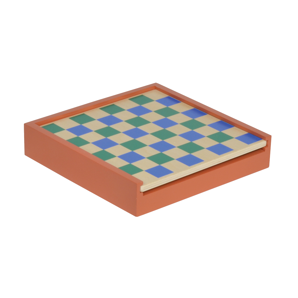 A double-sided chess checker board with pieces in various colors on a beige background, flipped to show the other side with a blue and white checkered pattern.