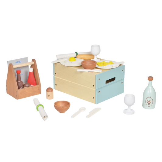 A pretend play restaurant set with wooden table, plastic food items, and wooden utensils.