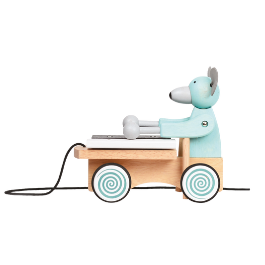 A plush toy xylophone in the shape of a mouse with a blue body, black and white accents, and a wooden xylophone cart with spinning wheels.