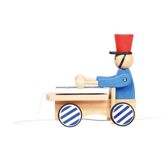 A toy xylophone with a cartoonishsoldier figure in a blue and red uniform pushing a cart with wooden bars. The toy has wheels and is designed for young children.