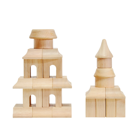Two wooden block constructions, resembling architectural models, placed against a white background.