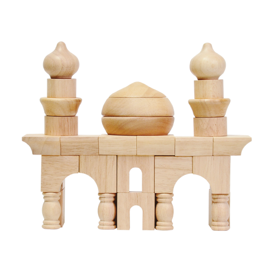 Wooden block construction toy resembling a small mosque with arches and minarets.