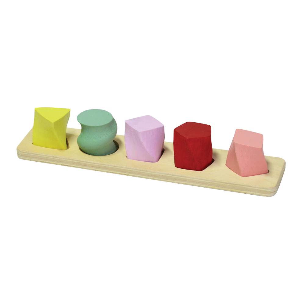 A set of colorful geometric shape sorters on a wooden board. The sorters are in shapes of a sphere, cube, cylinder, cone, and rectangular prism, each a different color.